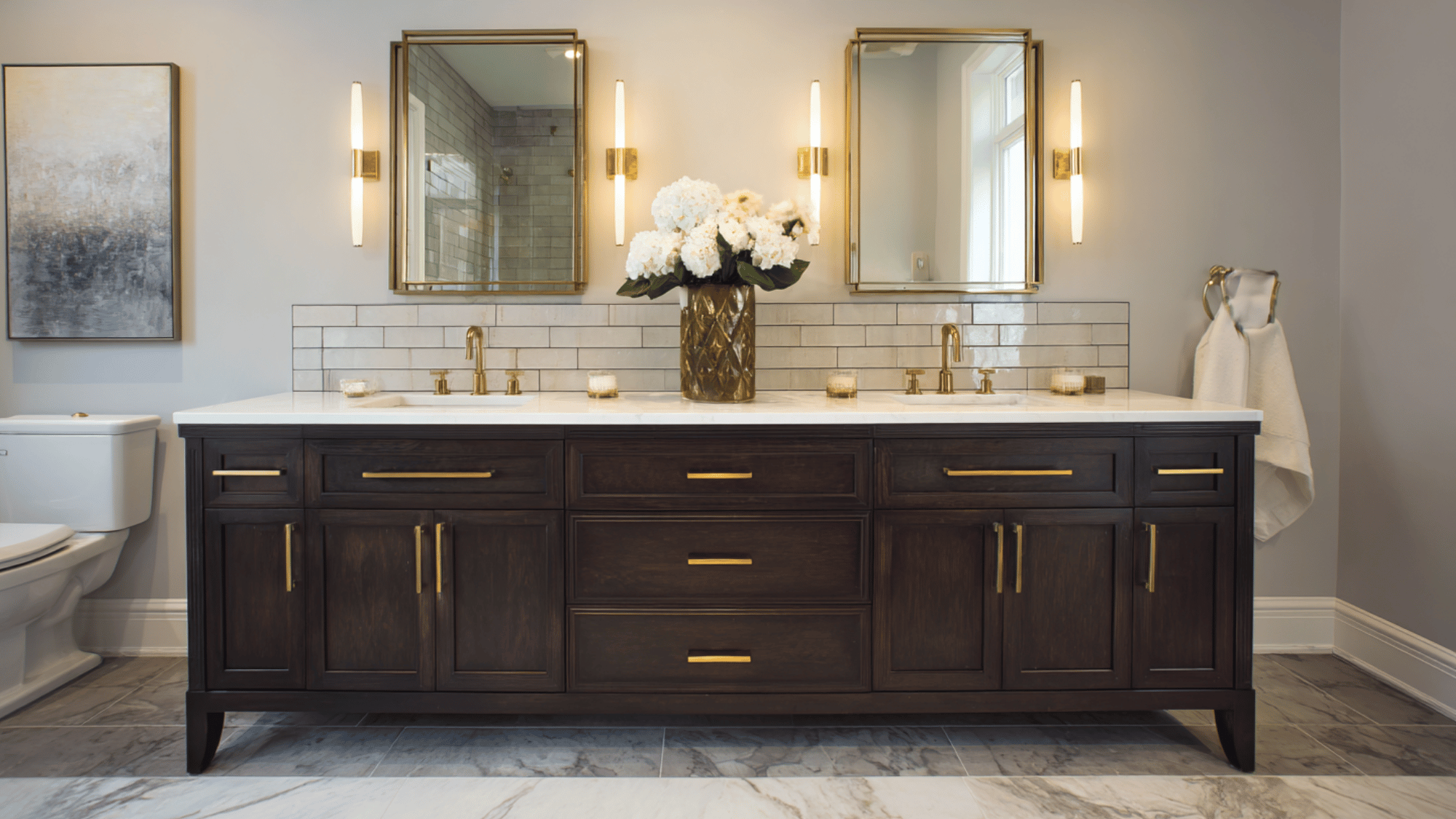 dark walnut double vanity with brass fixtures
